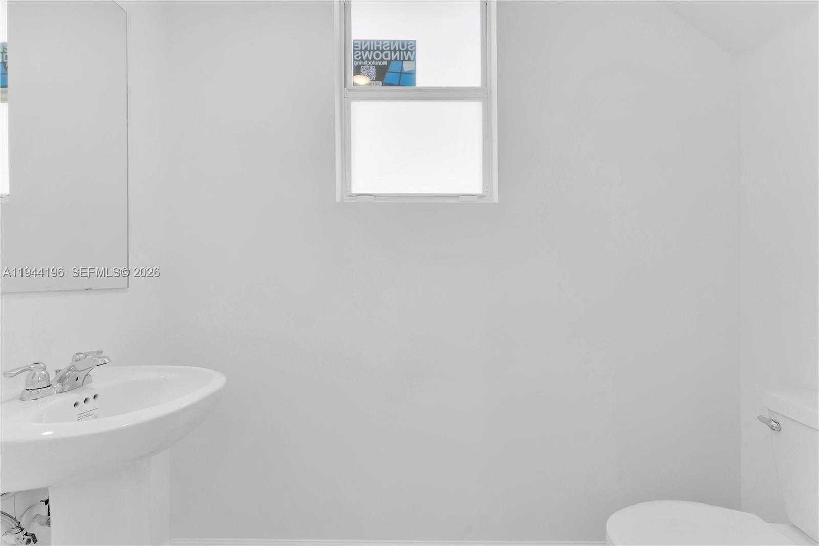 12168 Southwest 268th Street Homestead, FL 33032 - Photo 18 of 27 a bathroom with a sink and a toilet