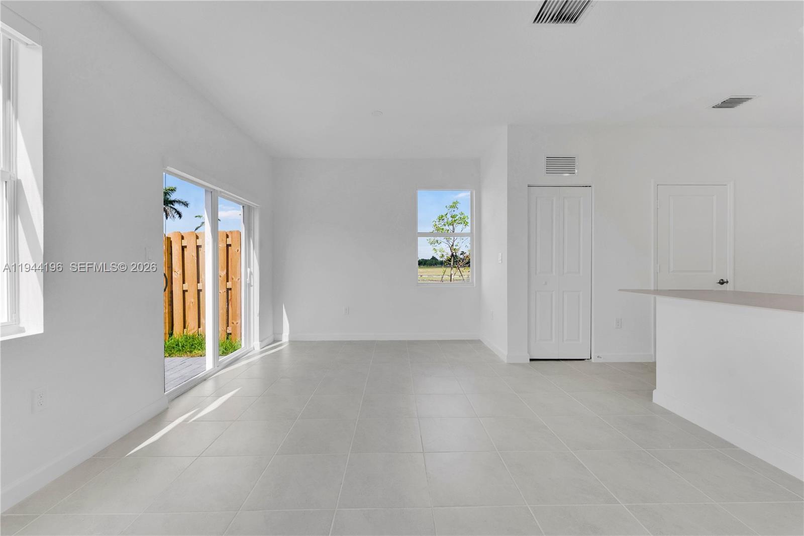 12168 Southwest 268th Street Homestead, FL 33032 - Photo 10 of 27 an empty room with windows