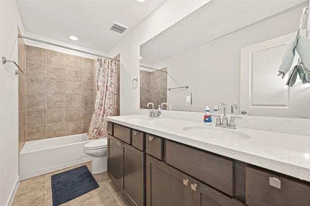 a bathroom with a sink toilet and vanity