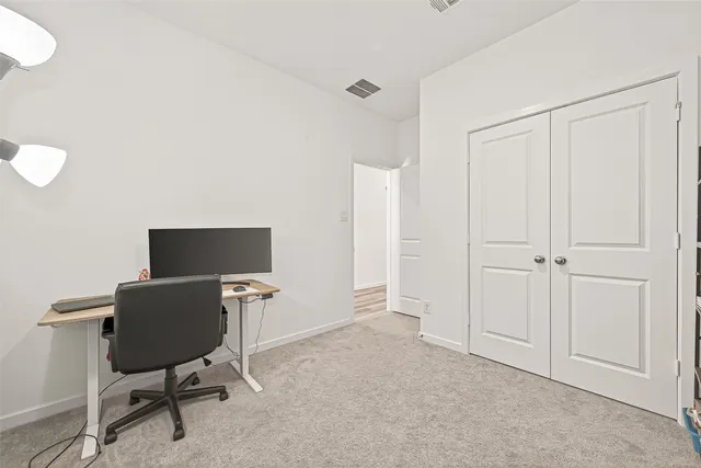 a view of an house with backyard space and balcony