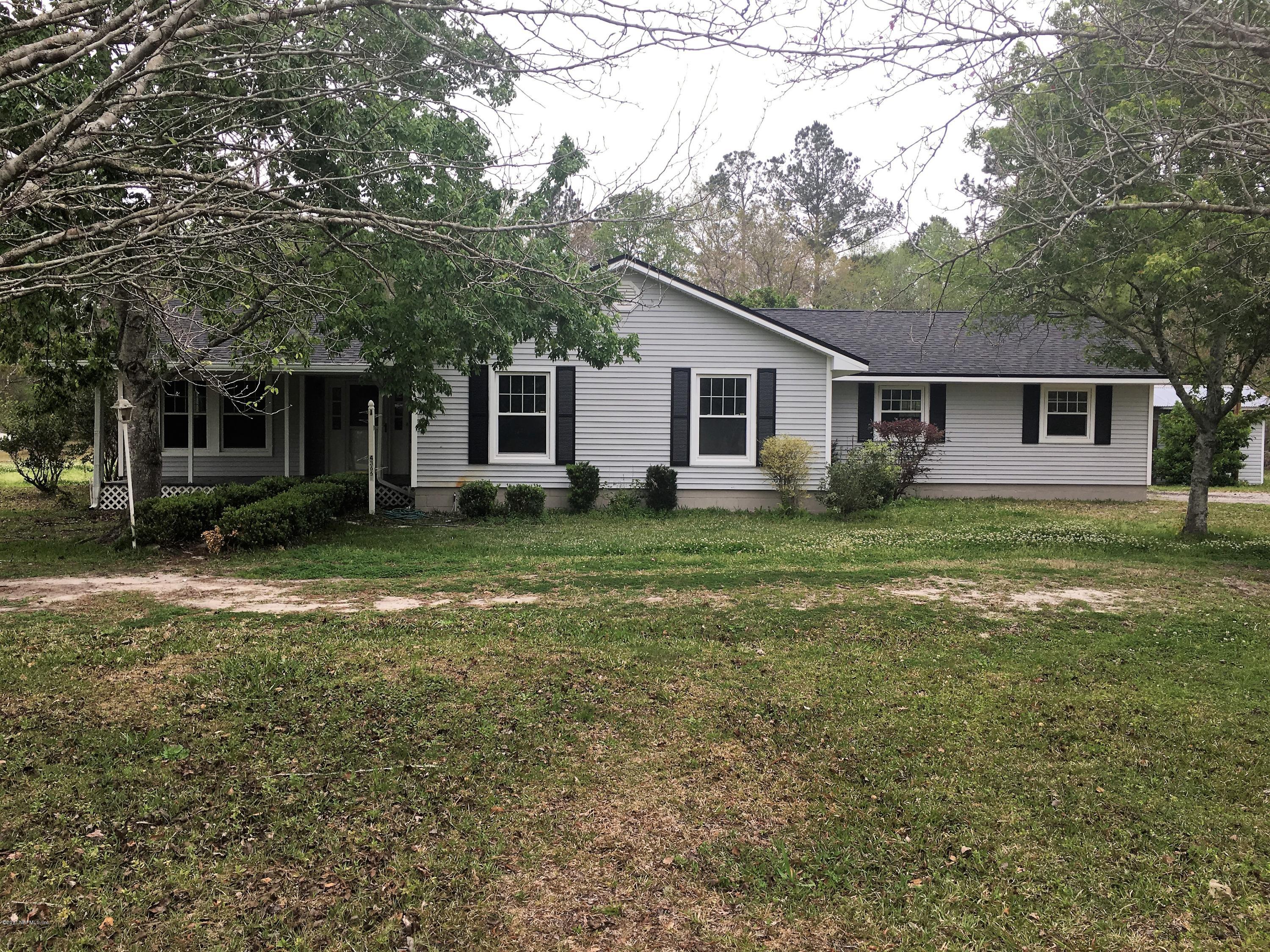 43663 Ratliff Road Callahan, FL 32011 - Photo 1 of 36 a view of a house with yard and a tree