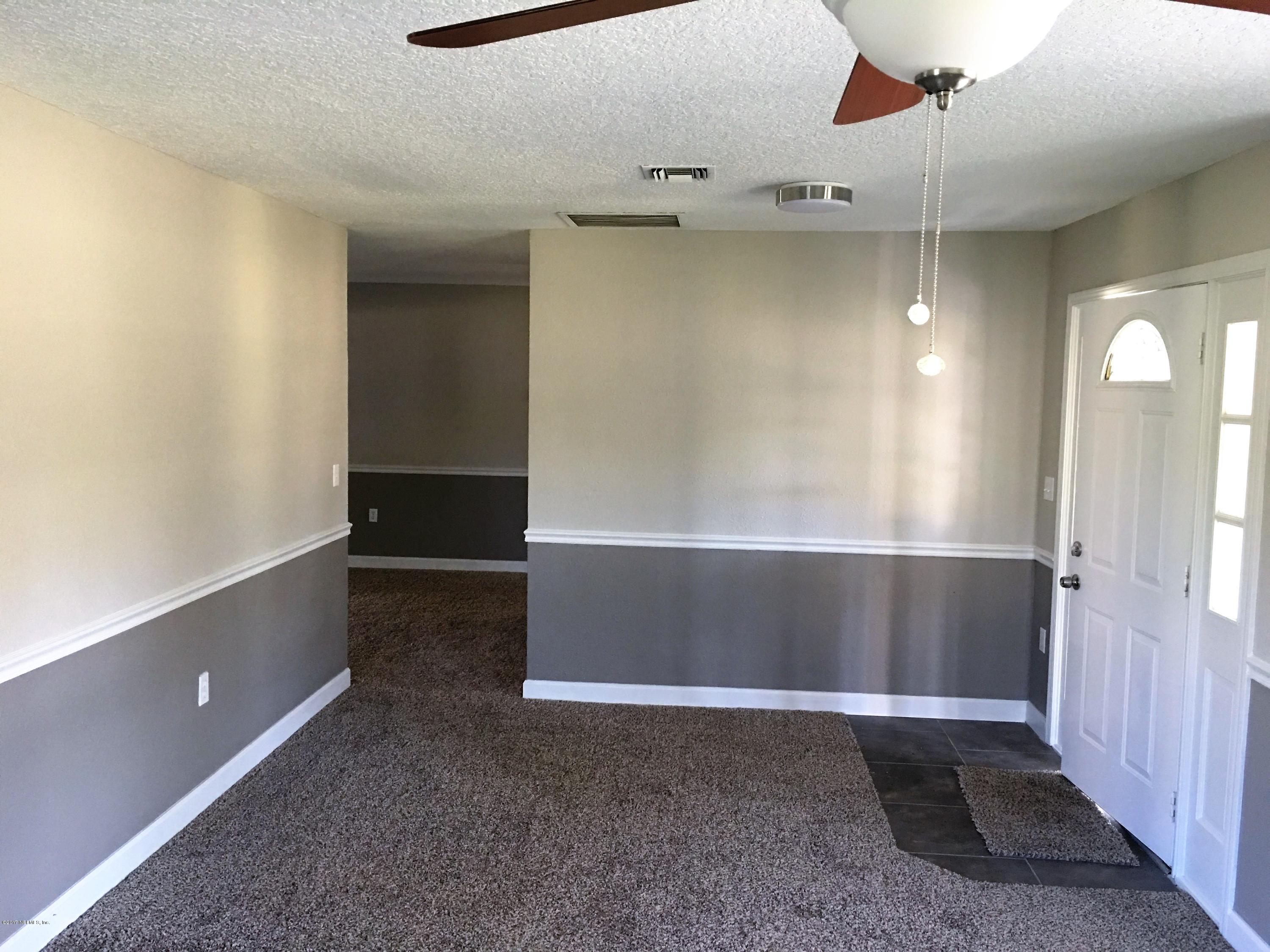 43663 Ratliff Road Callahan, FL 32011 - Photo 14 of 36 a view of an empty room with a window
