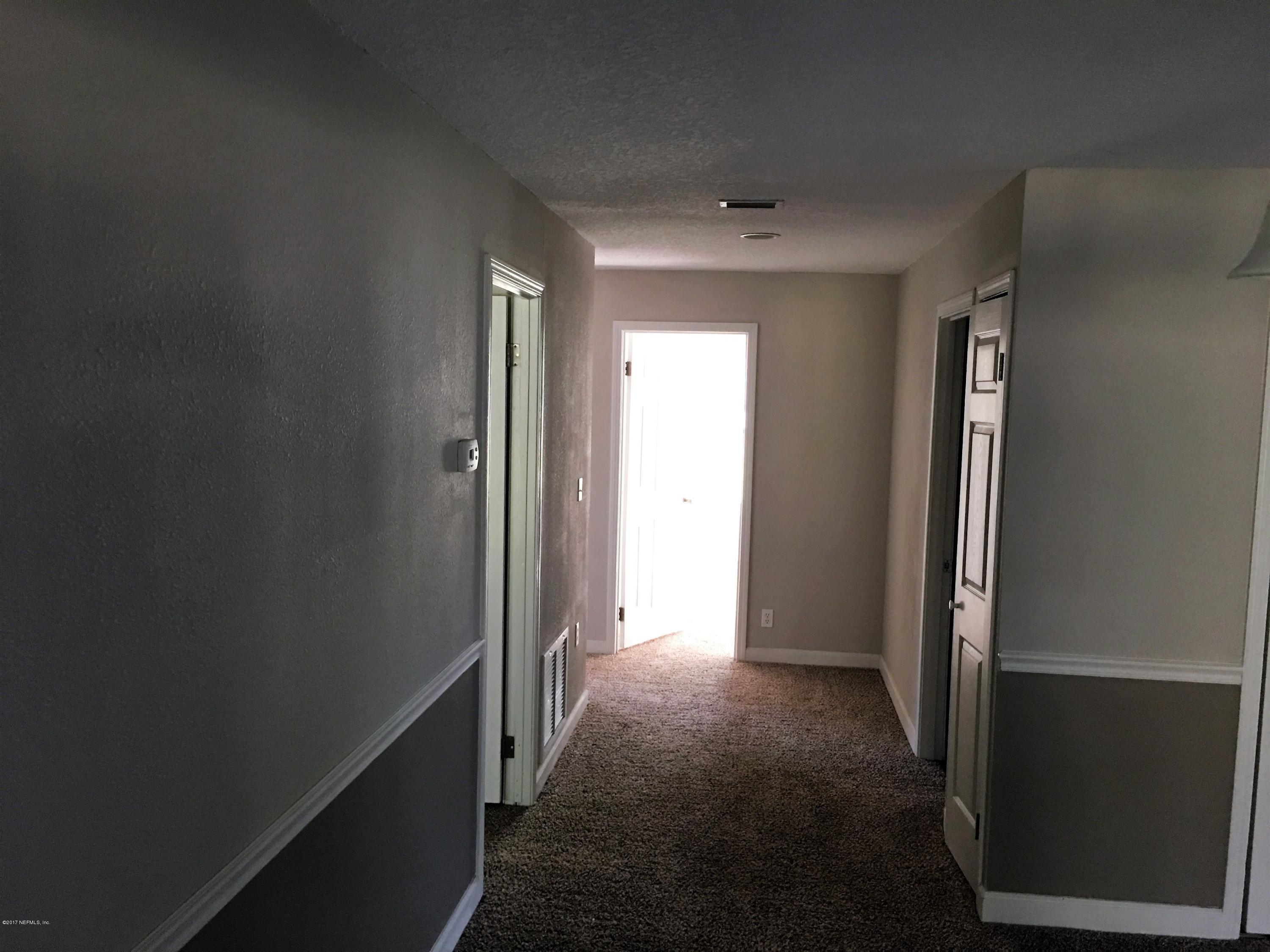 43663 Ratliff Road Callahan, FL 32011 - Photo 19 of 36 an empty room with windows and closet