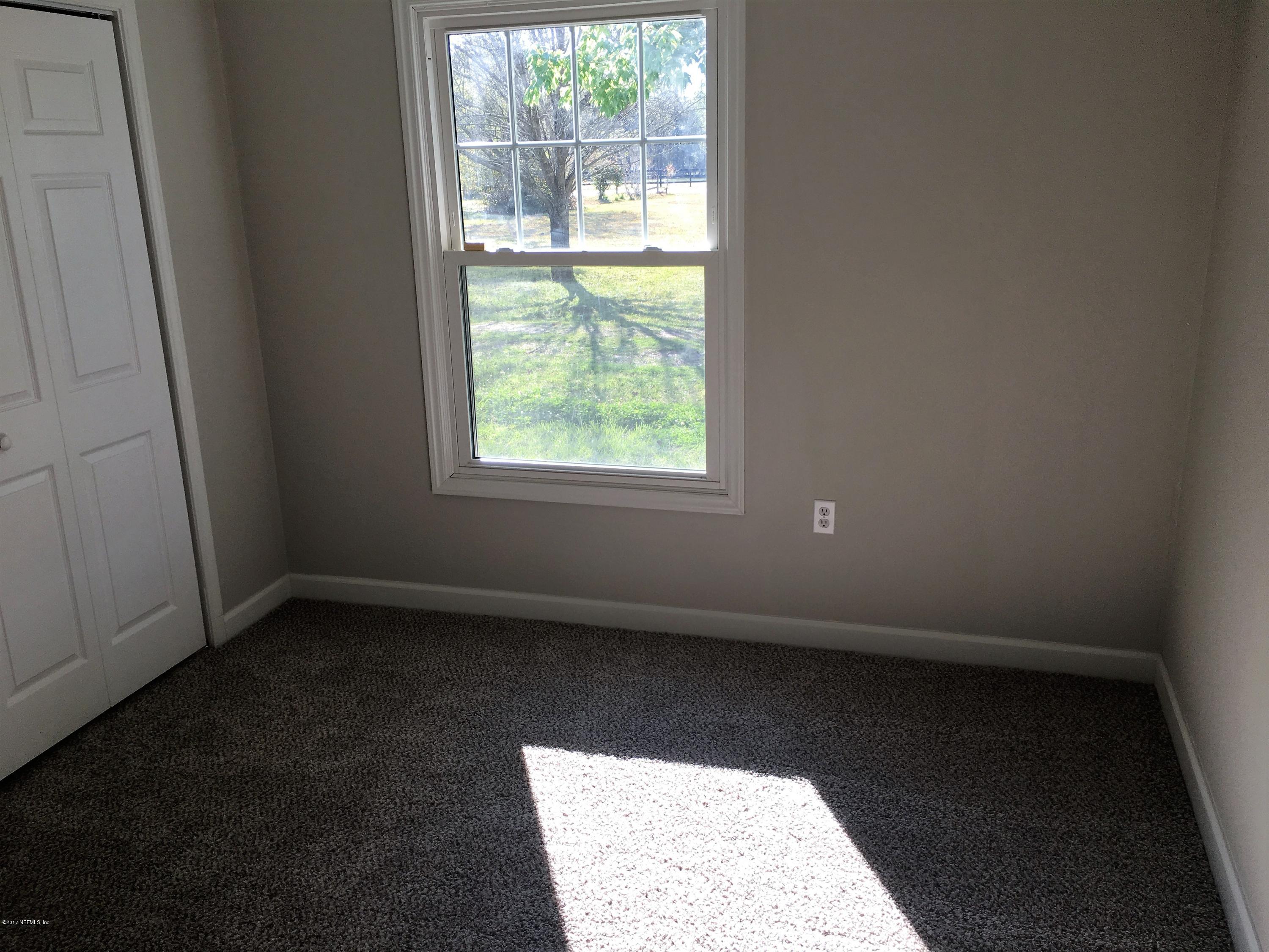 43663 Ratliff Road Callahan, FL 32011 - Photo 25 of 36 an empty room with a window
