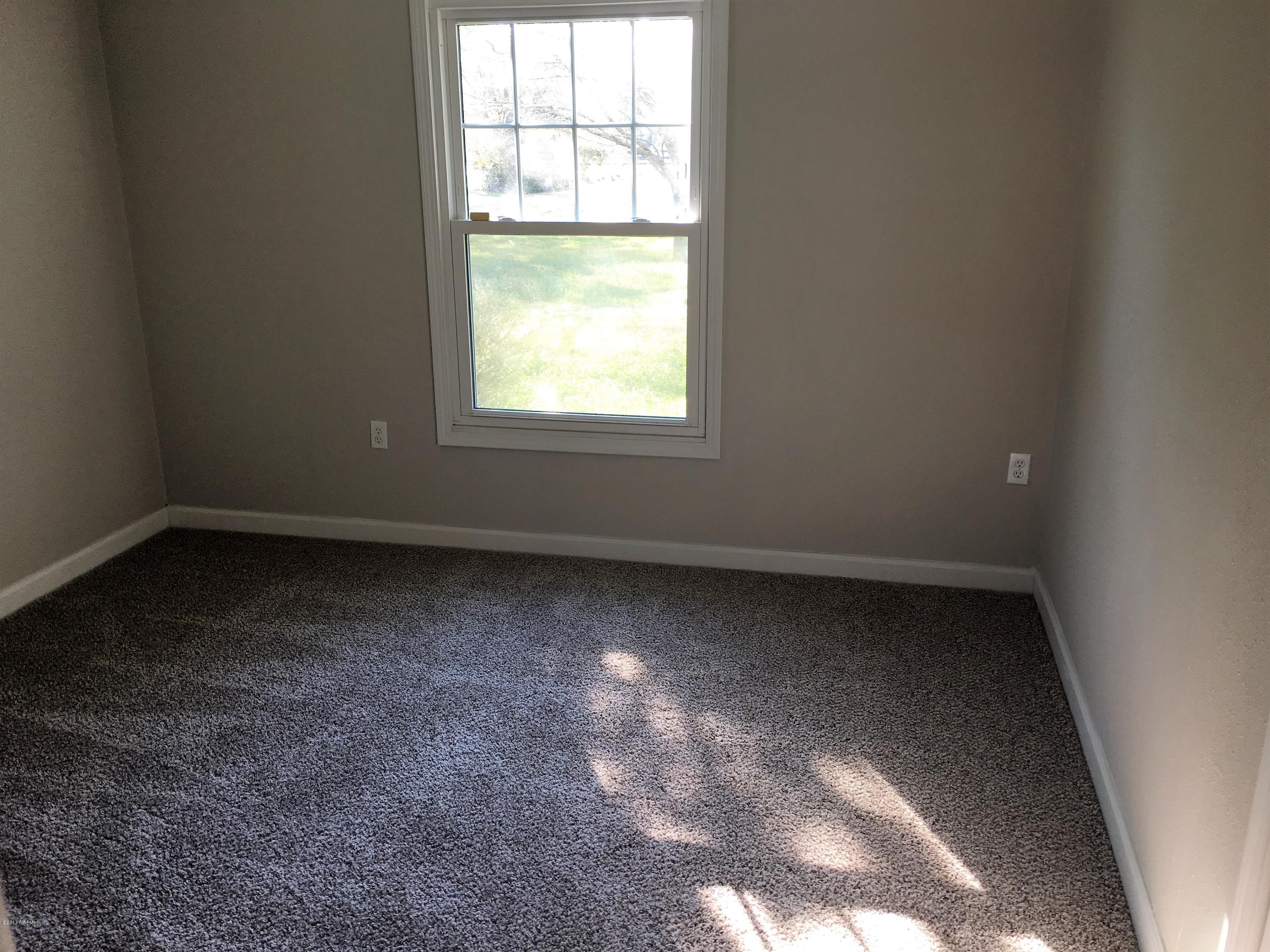 43663 Ratliff Road Callahan, FL 32011 - Photo 26 of 36 an empty room with a window