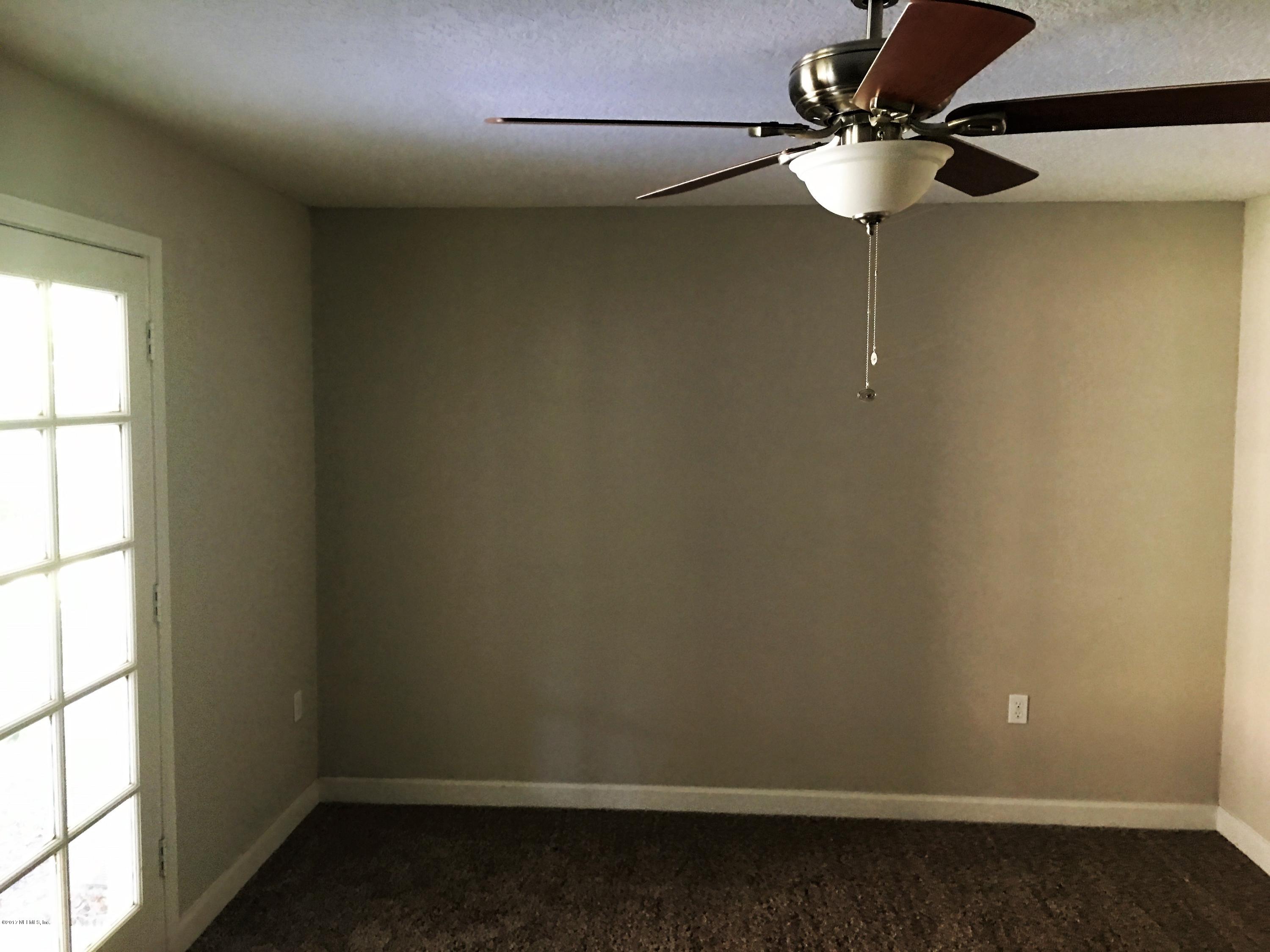 43663 Ratliff Road Callahan, FL 32011 - Photo 29 of 36 an empty room with a window
