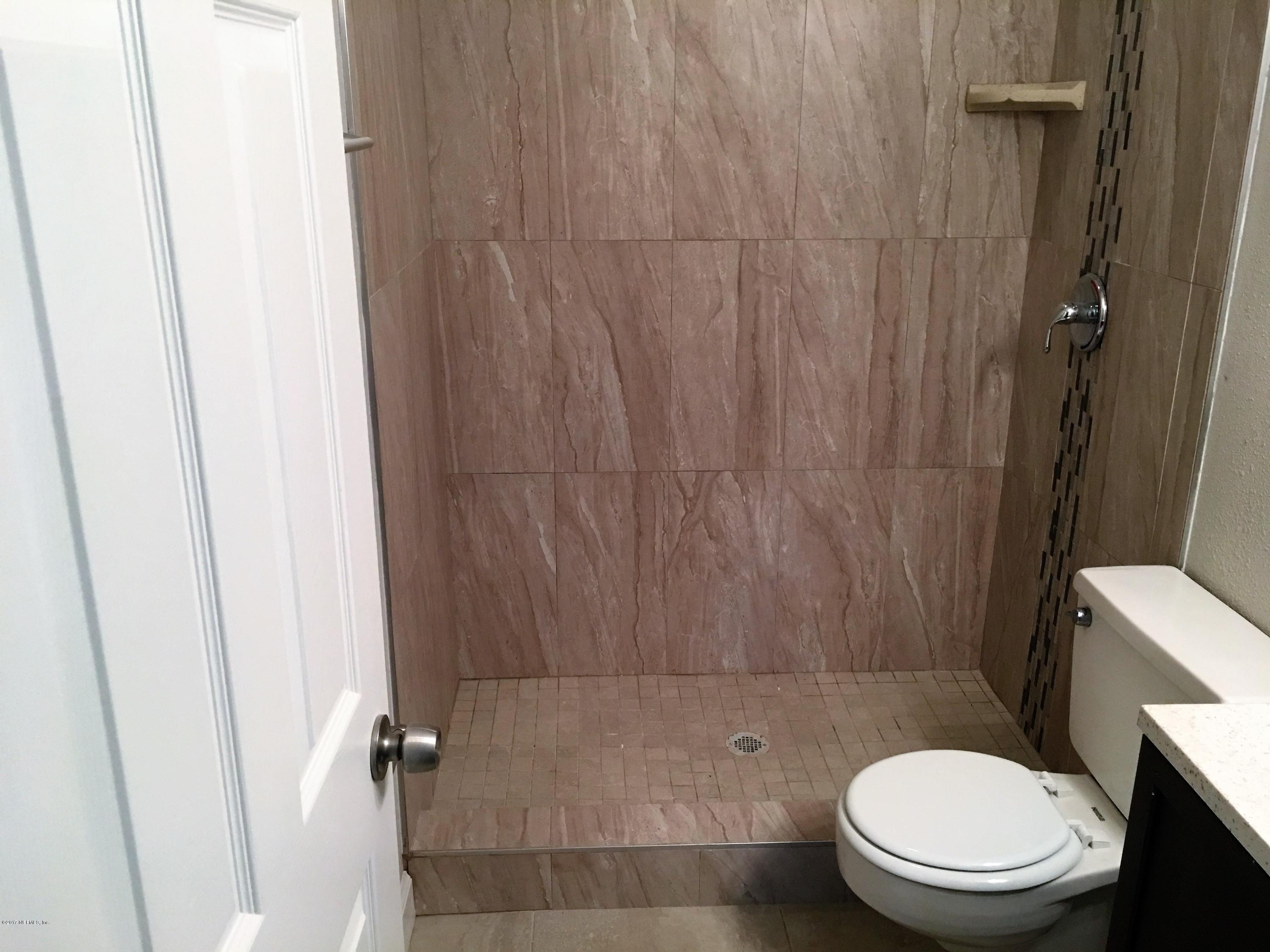 43663 Ratliff Road Callahan, FL 32011 - Photo 31 of 36 a bathroom with a toilet and a shower