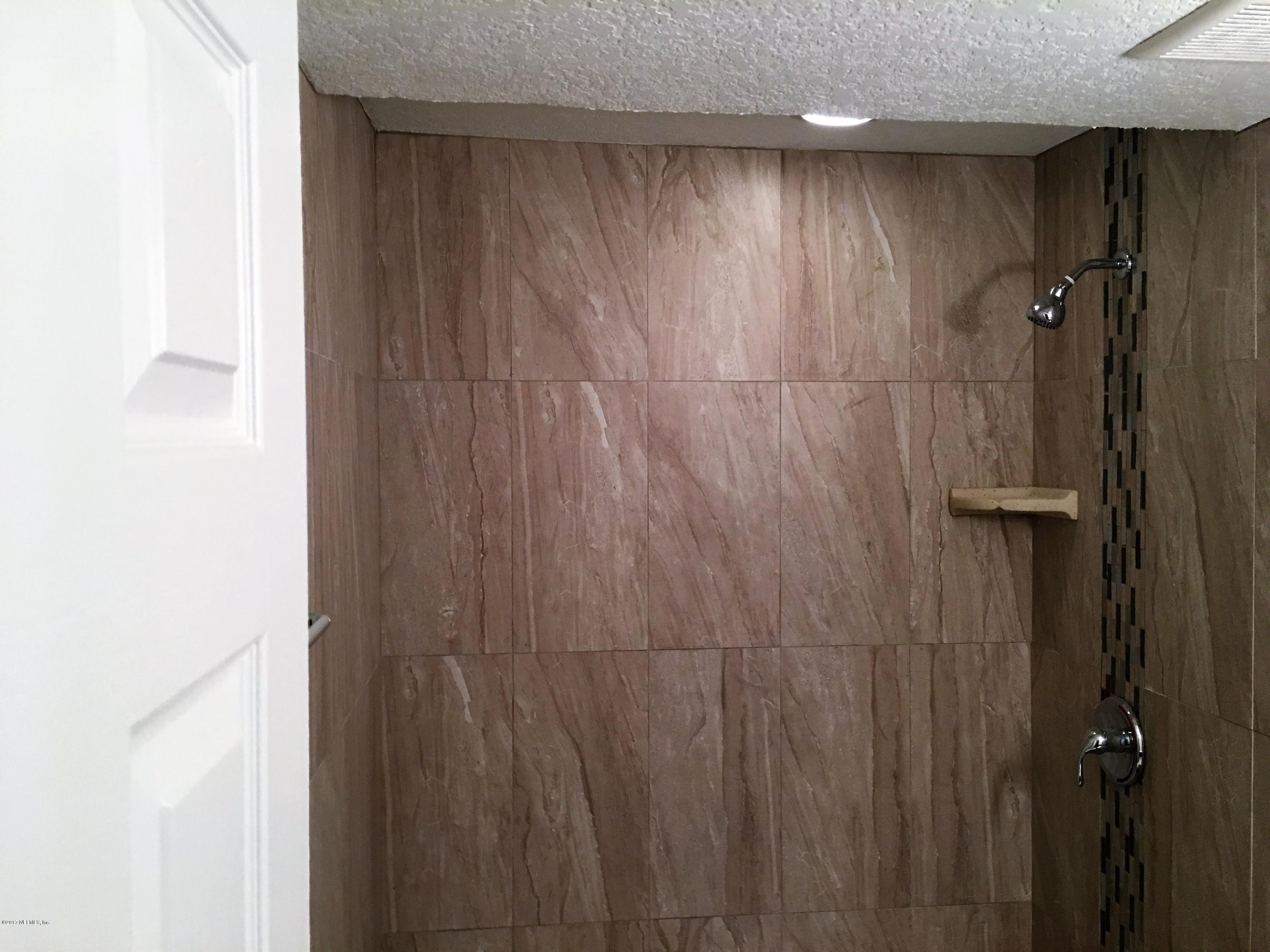 43663 Ratliff Road Callahan, FL 32011 - Photo 33 of 36 a bathroom with a shower and a shower