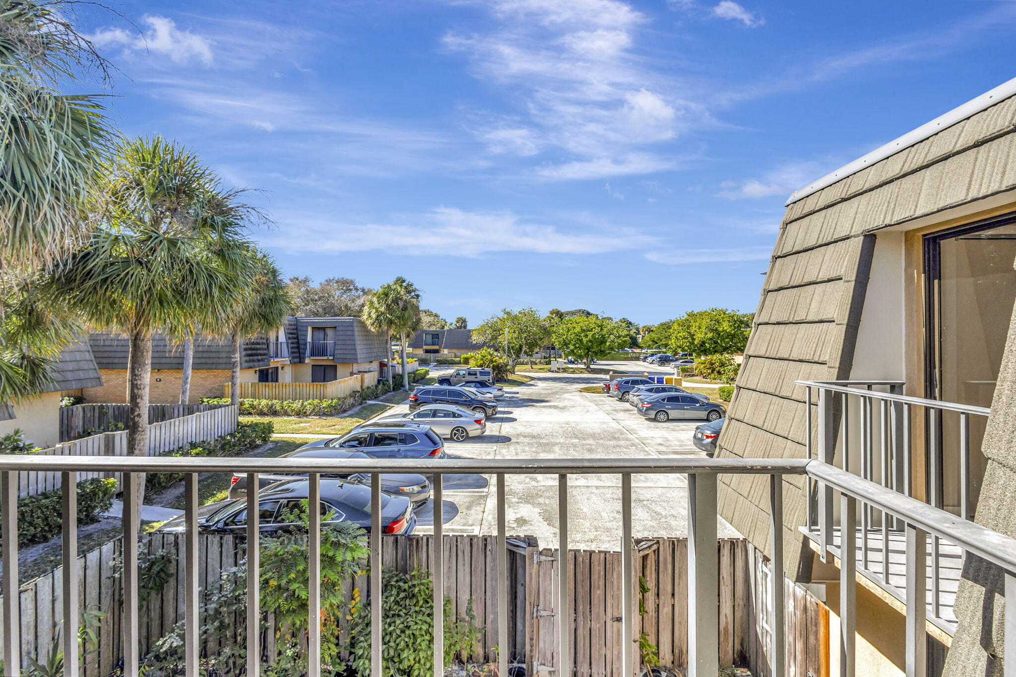 318 3rd Way West Palm Beach, FL 33407 - Photo 14 of 26 a view of a balcony with wooden floor and fence