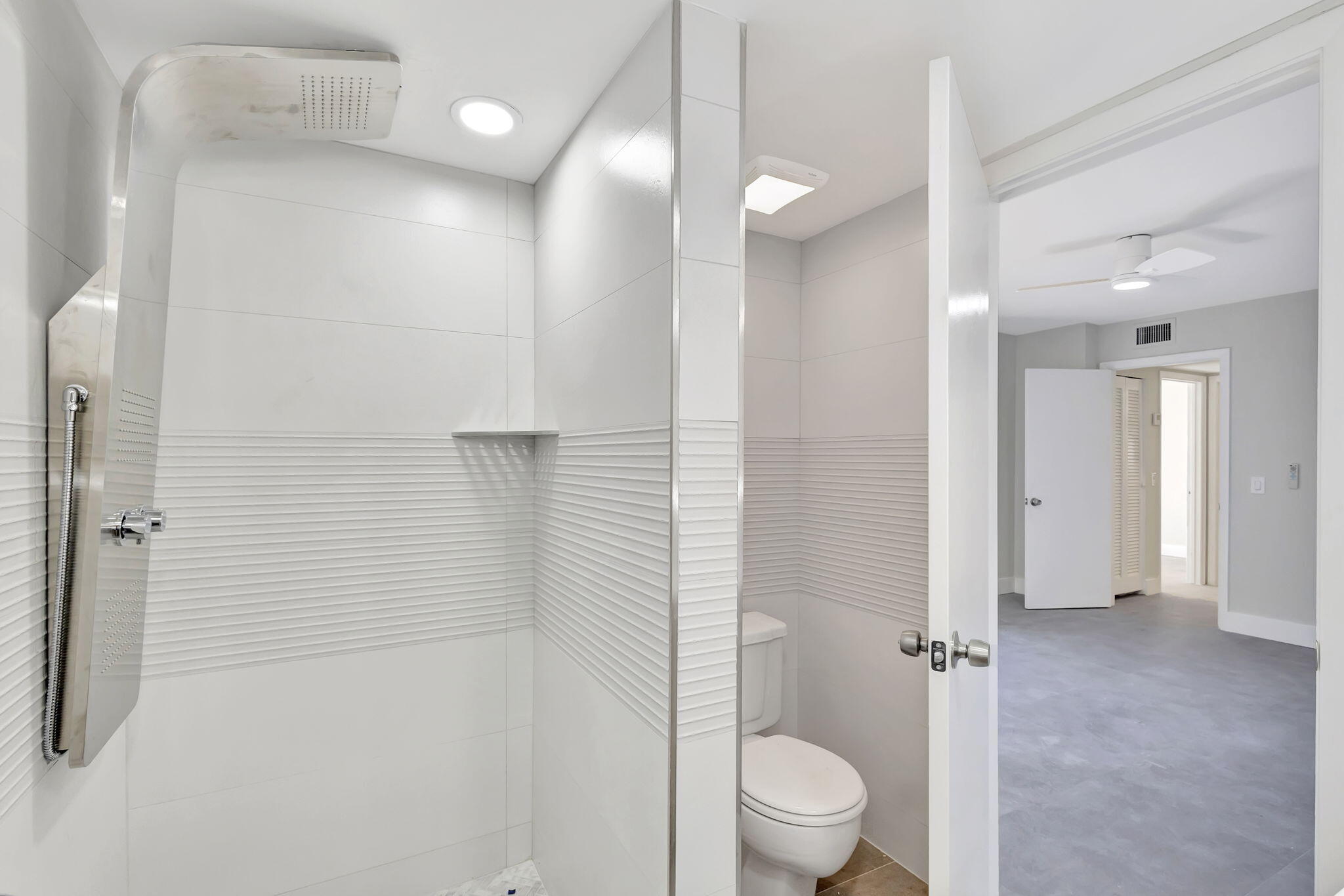 318 3rd Way West Palm Beach, FL 33407 - Photo 15 of 26 a bathroom with a granite countertop sink a toilet and shower