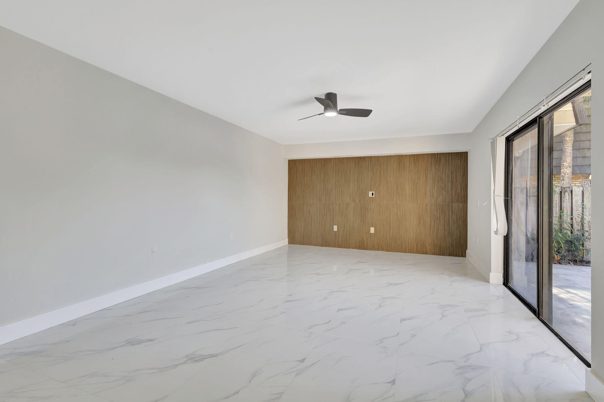 318 3rd Way West Palm Beach, FL 33407 - Photo 6 of 26 a view of an empty room with a window