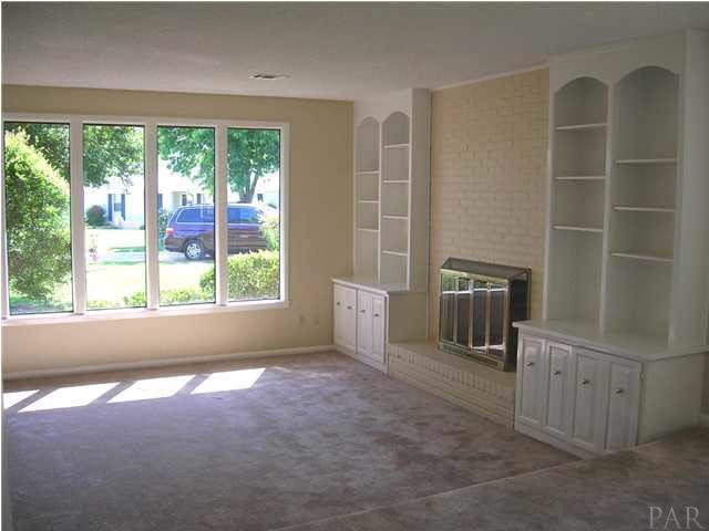 Fireplace with built-in shelving