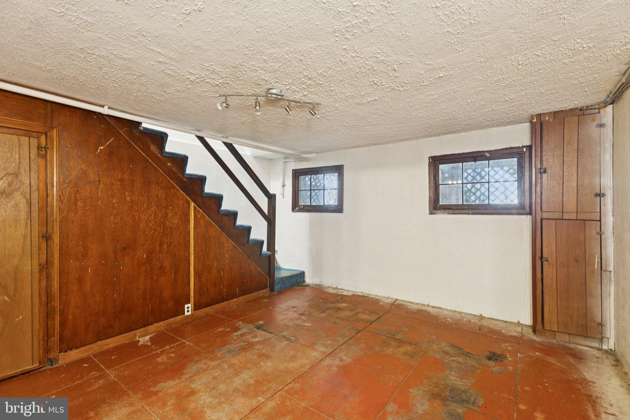1633 R Street Southeast Washington, DC 20020 - Photo 22 of 44 a view of a big room with staircase and stairs