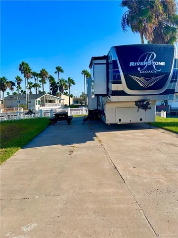 a view of a car park in front of house