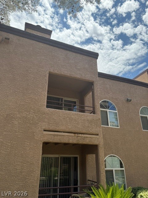 9325 West Desert Inn Road, Unit 278 Las Vegas, NV 89117 - Photo 16 of 17 Textured stucco exterior and arched windows create an inviting curb appeal.