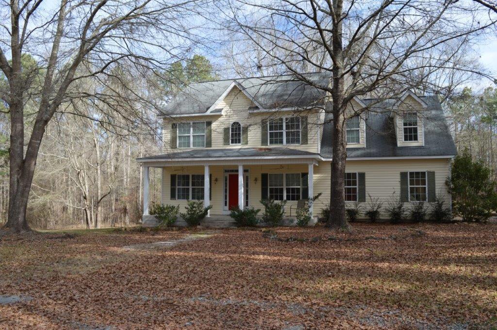 163 Oliver Greene Road Gray, GA 31032 - Photo 2 of 19 a front view of a house with garden