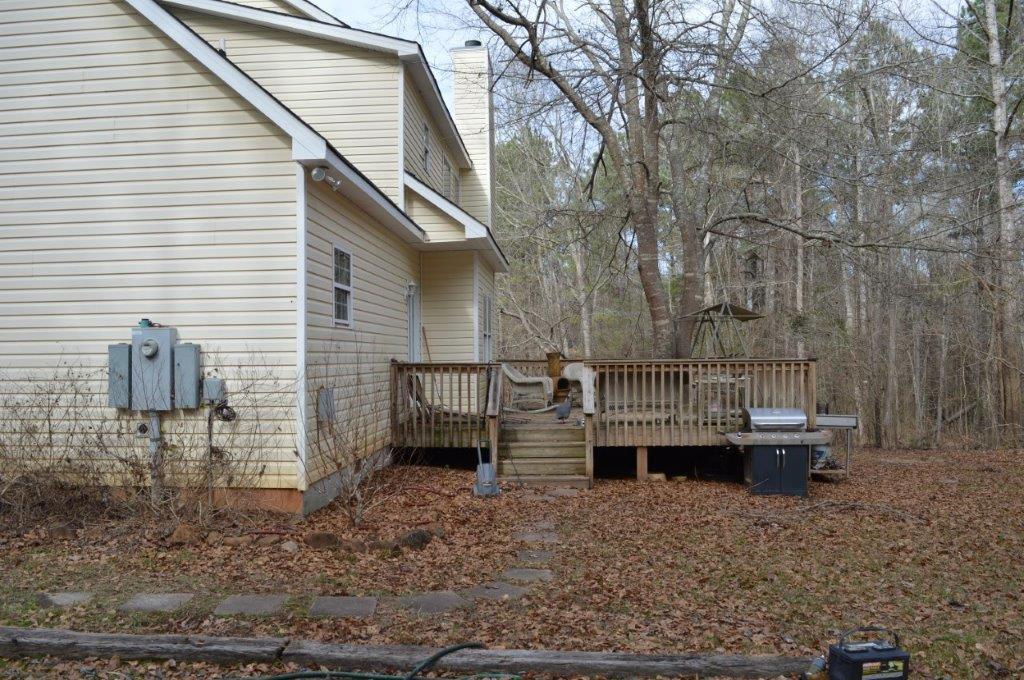 163 Oliver Greene Road Gray, GA 31032 - Photo 11 of 19 a view of house with a deck and backyard
