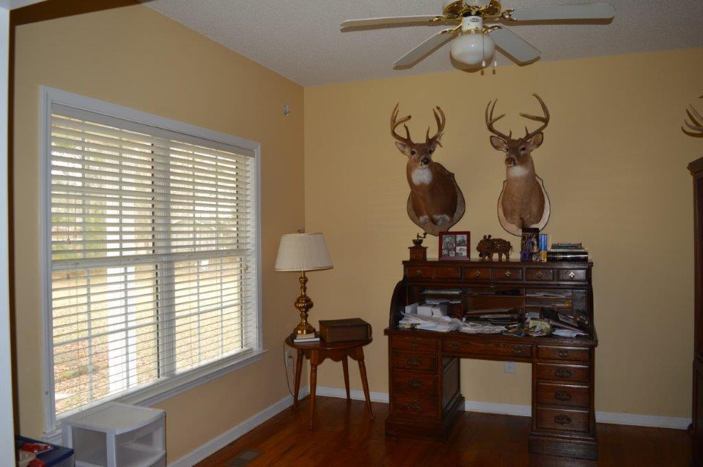 163 Oliver Greene Road Gray, GA 31032 - Photo 13 of 19 a view of a room with a window and wooden floor