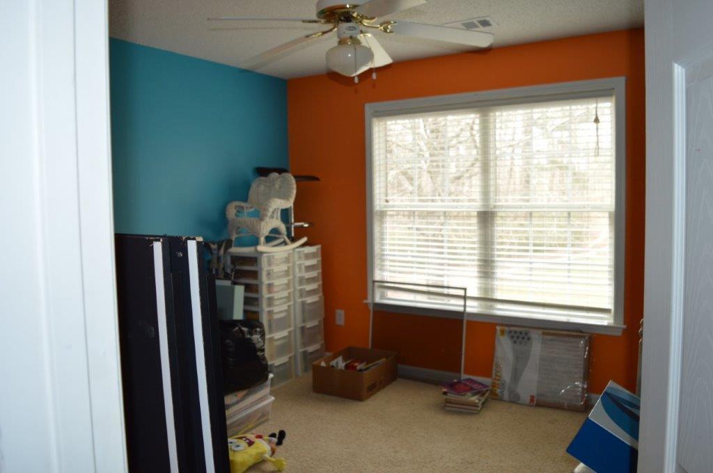 163 Oliver Greene Road Gray, GA 31032 - Photo 18 of 19 a room with window and stairs
