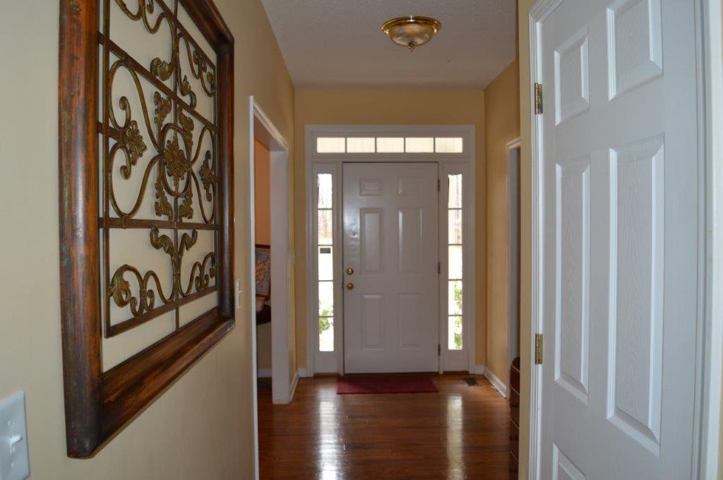 163 Oliver Greene Road Gray, GA 31032 - Photo 3 of 19 a view of a entryway door with wooden floor
