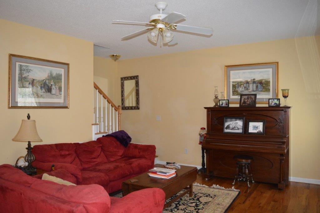 163 Oliver Greene Road Gray, GA 31032 - Photo 5 of 19 a living room with furniture and a piano