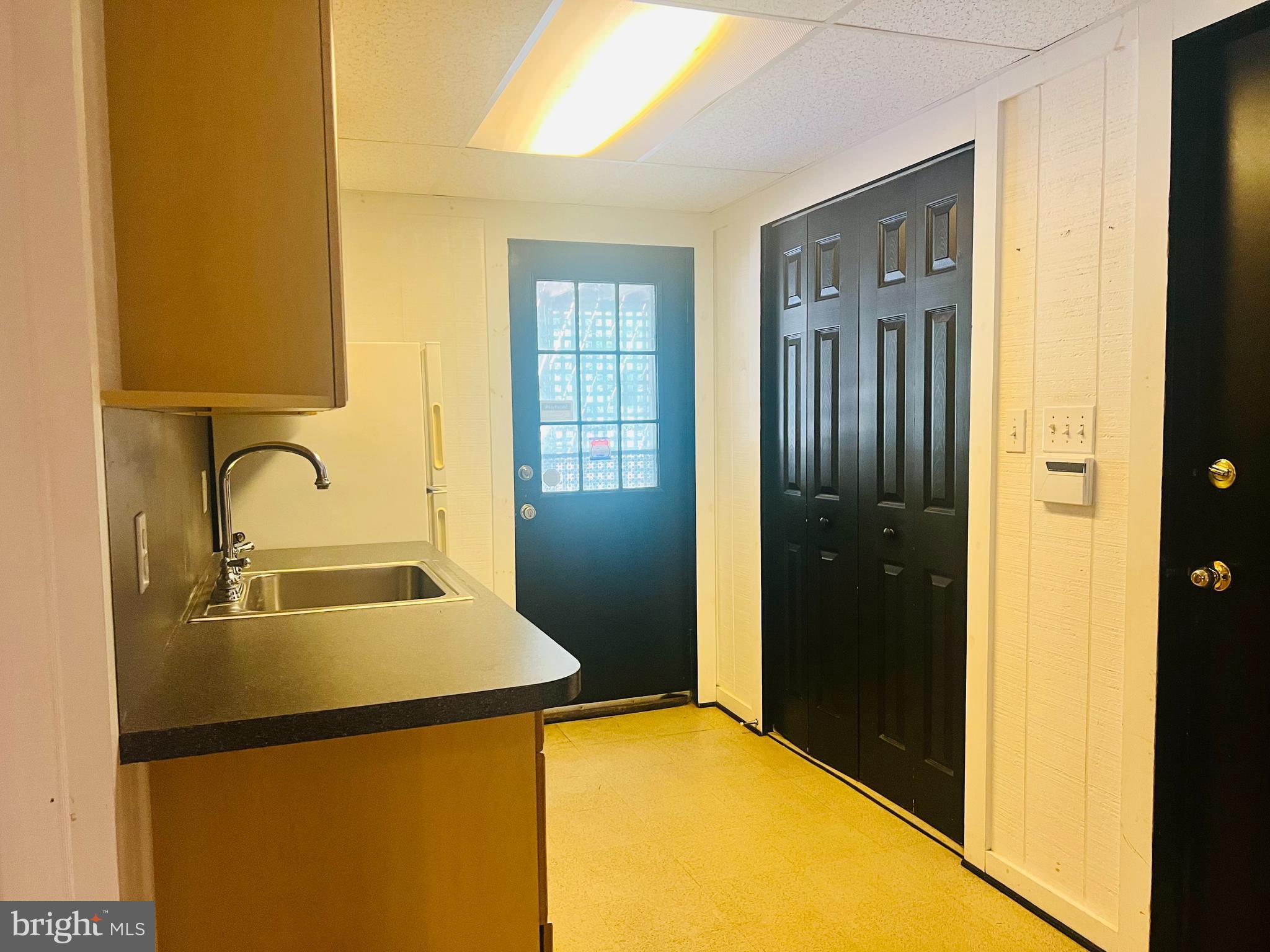 15729 Holly Grove Road Silver Spring, MD 20905 - Photo 37 of 37 Basement access to garage and yard walk-out