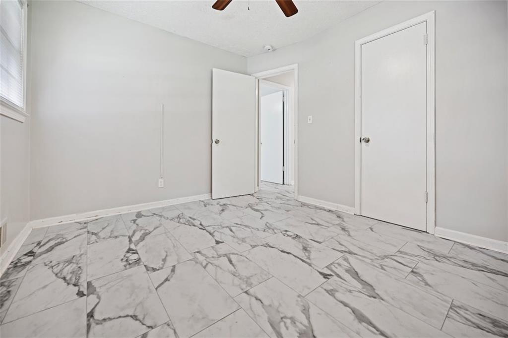 7039 Rockbridge Road Southwest Stone Mountain, GA 30087 - Photo 17 of 28 a view of a bedroom