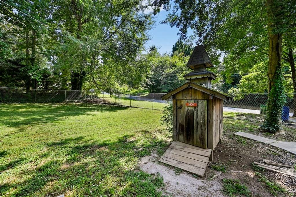 7039 Rockbridge Road Southwest Stone Mountain, GA 30087 - Photo 25 of 28 a view of a park with large trees