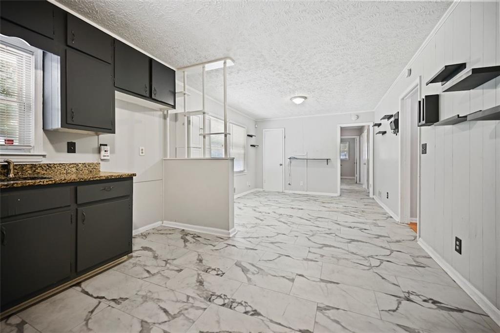 7039 Rockbridge Road Southwest Stone Mountain, GA 30087 - Photo 8 of 28 a bathroom with a sink toilet and shower
