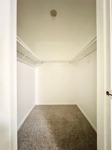 a bathroom with a granite countertop sink a toilet and a bathtub