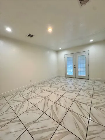 a view of a hallway with a chandelier