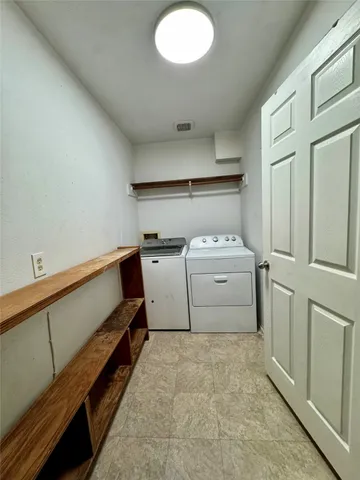 a view of a garden with lawn chairs