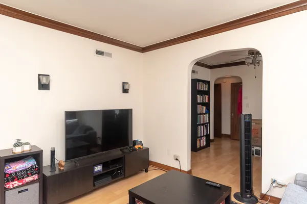 a view of a livingroom with furniture and a flat screen tv