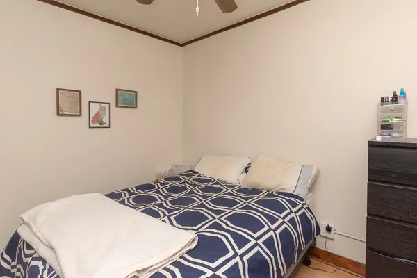 a bedroom with a bed and a cabinets