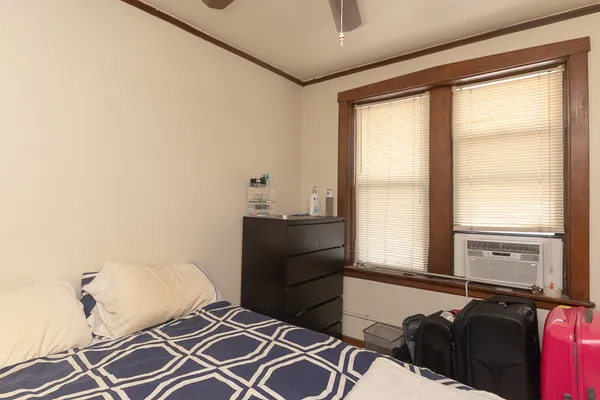 a room with a bed and a window