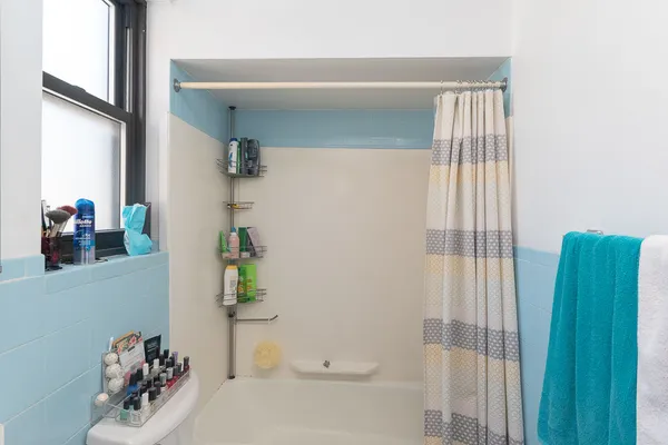 a bathroom with a sink and a shower curtain