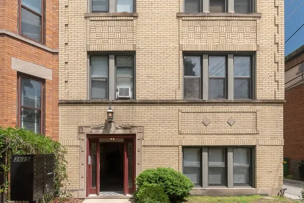 front view of a brick house with a large windows