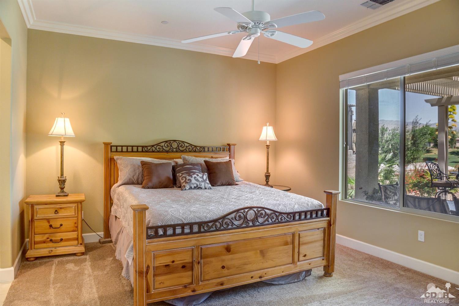 81340 Corte Compras Indio, CA 92203 - Photo 15 of 43 a bedroom with a bed and wooden floor