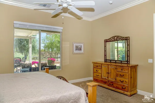 a bedroom with a bed dresser and a window