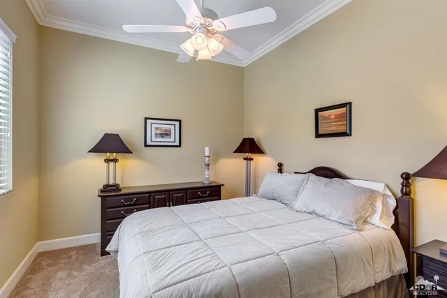 a bedroom with a bed and a lamp