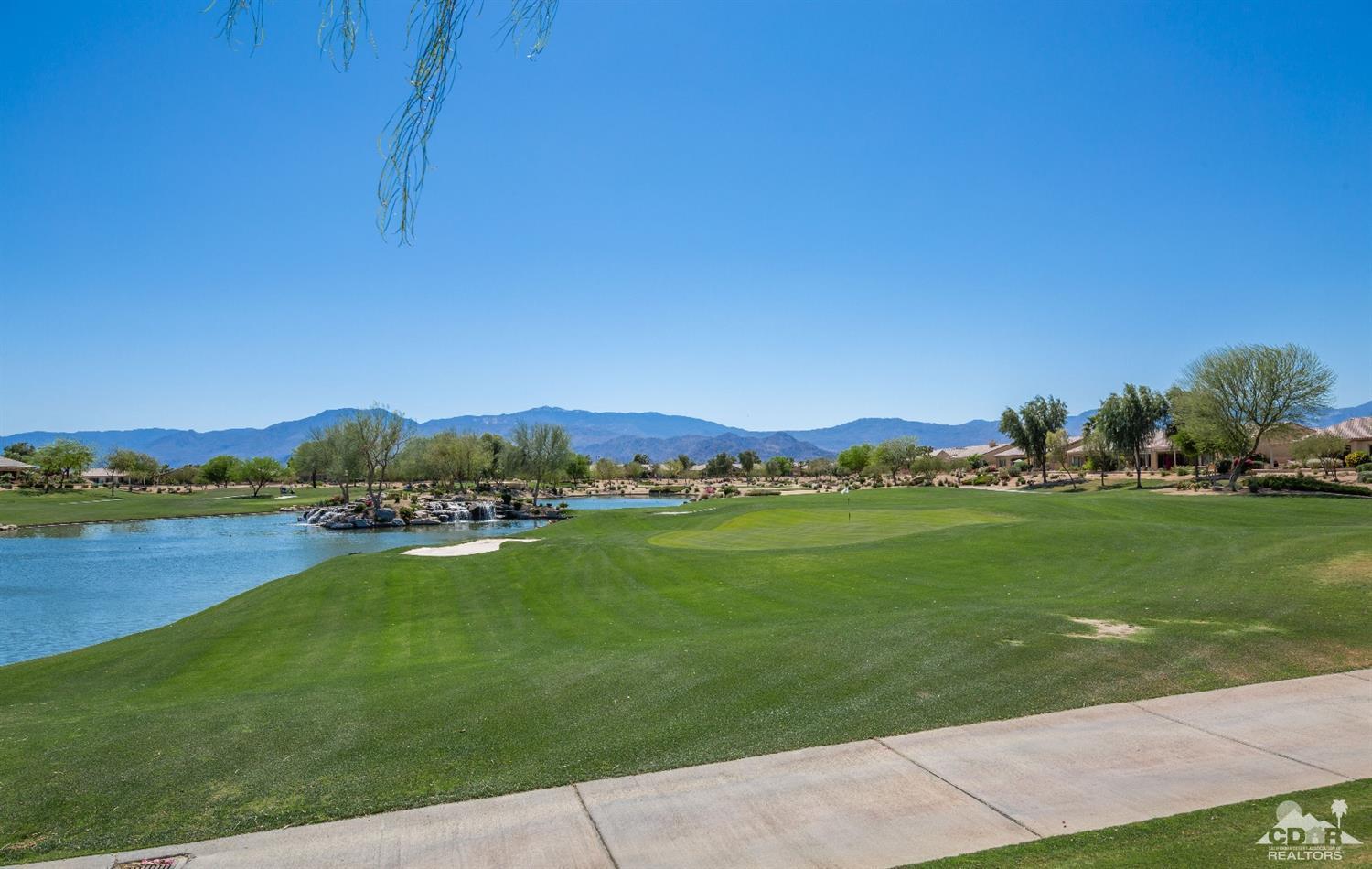 81340 Corte Compras Indio, CA 92203 - Photo 33 of 43 a view of a lake with houses in the background