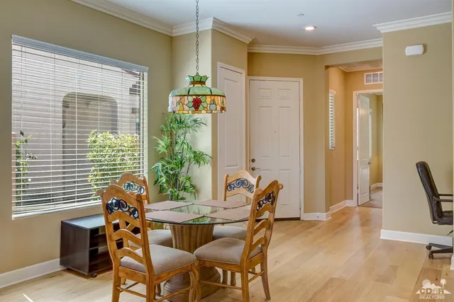 a view of a dining room with furniture and window