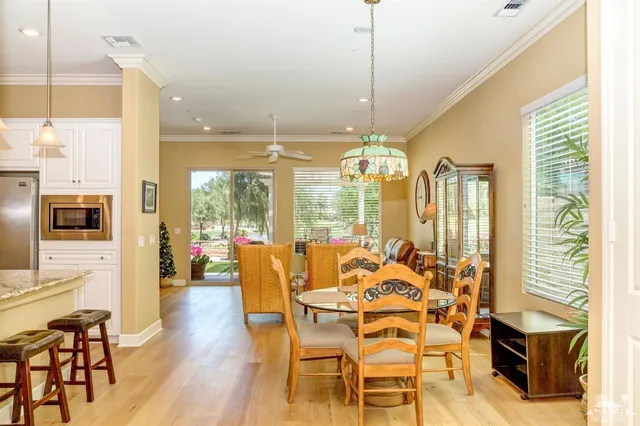 a view of a dining room with furniture window and wooden floor