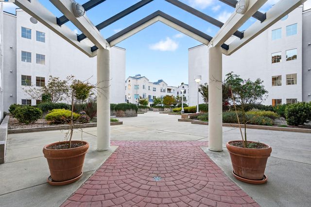 a swimming pool with outdoor seating and yard