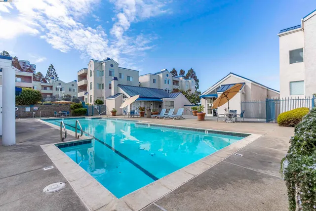 a view of a patio with swimming pool