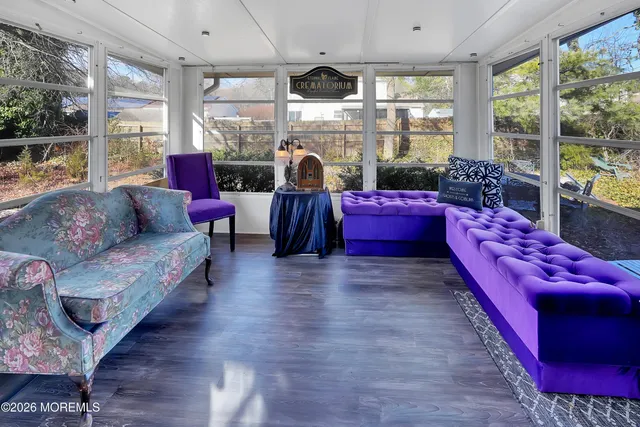 a kitchen with stainless steel appliances kitchen island granite countertop a refrigerator a sink dishwasher and a stove with wooden cabinets