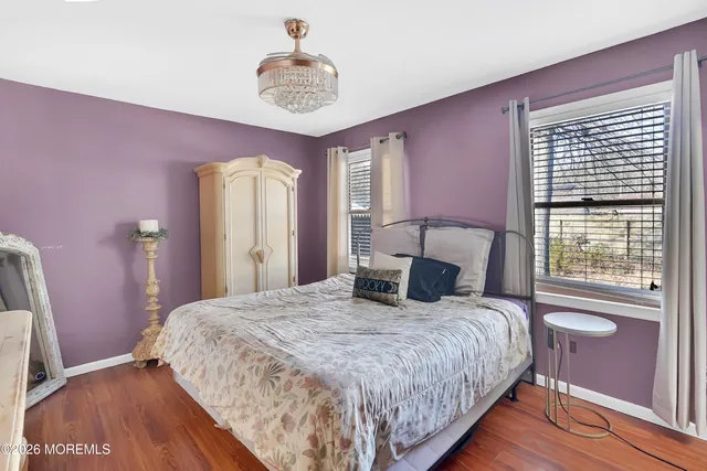 a bathroom with a sink mirror and toilet