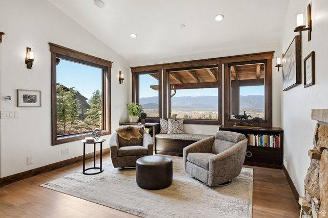7885 North Rabbitbrush Court, Unit 13 Park City, UT 84098 - Photo 17 of 88 Spacious room with wood-finish flooring, white walls, and vaulted ceilings