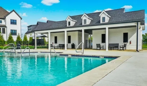 a view of a patio with couches chairs and pool table and chairs