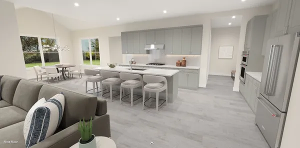 a living room with furniture a large window and a table